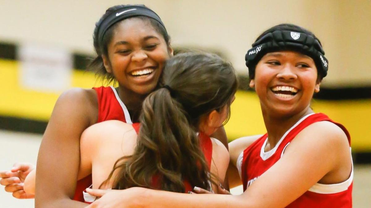 Wellington's Lauryn Snipes, left, Makenna Adams (12) and Shayland French.