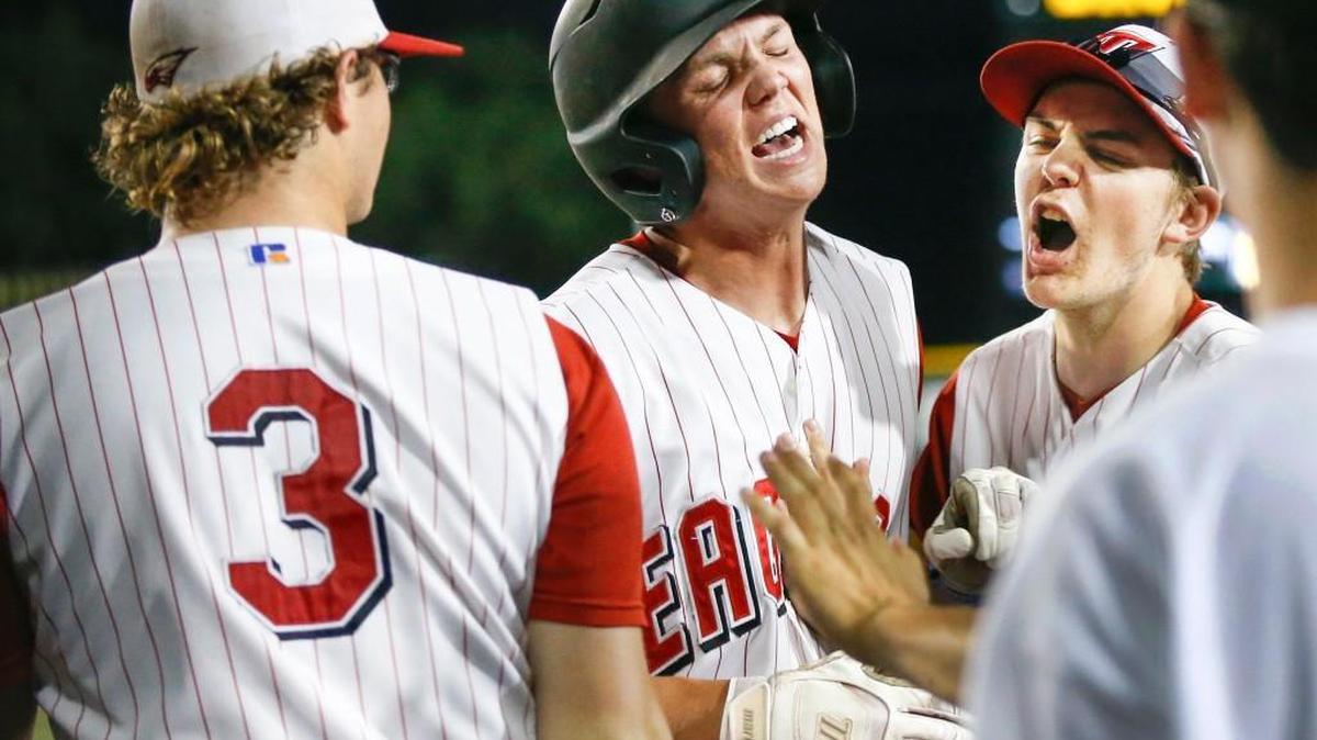 Maize's Jacob Taylor, center, is congratulated after scoring against Maize South in the fifth inning of Thursday’s Class 5A quarterfinal. Maize won 5-4.