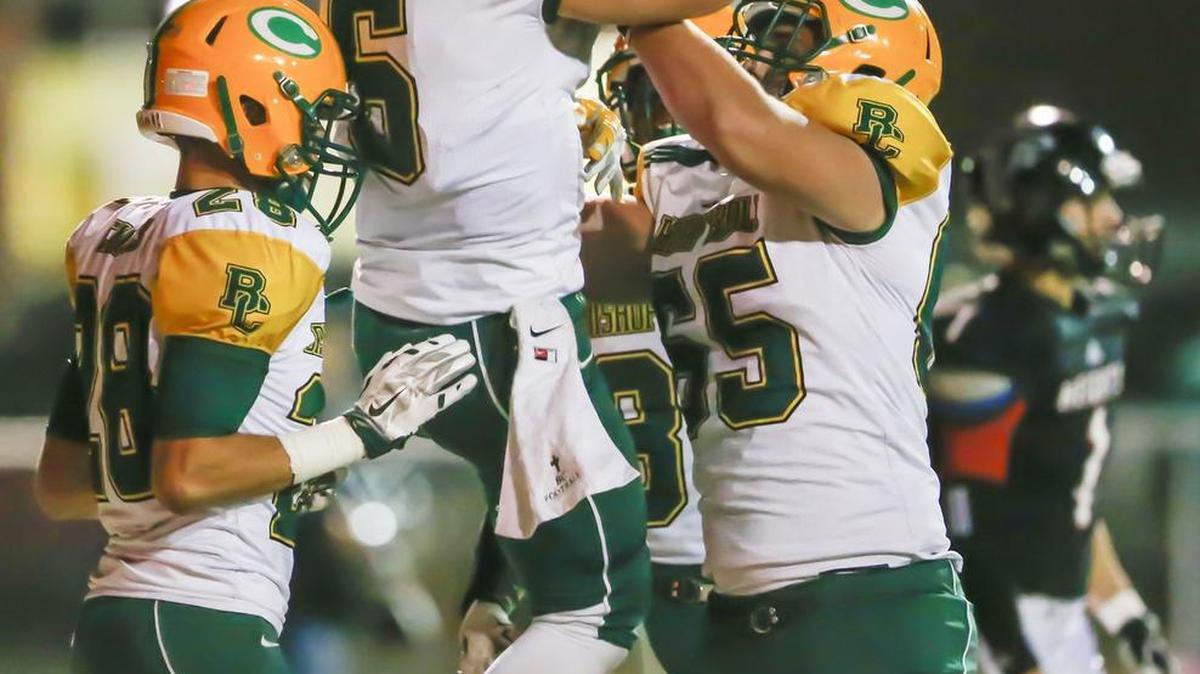 Carroll's Adam Theis (6) is congratulated after his TD against Heights in the second quarter.