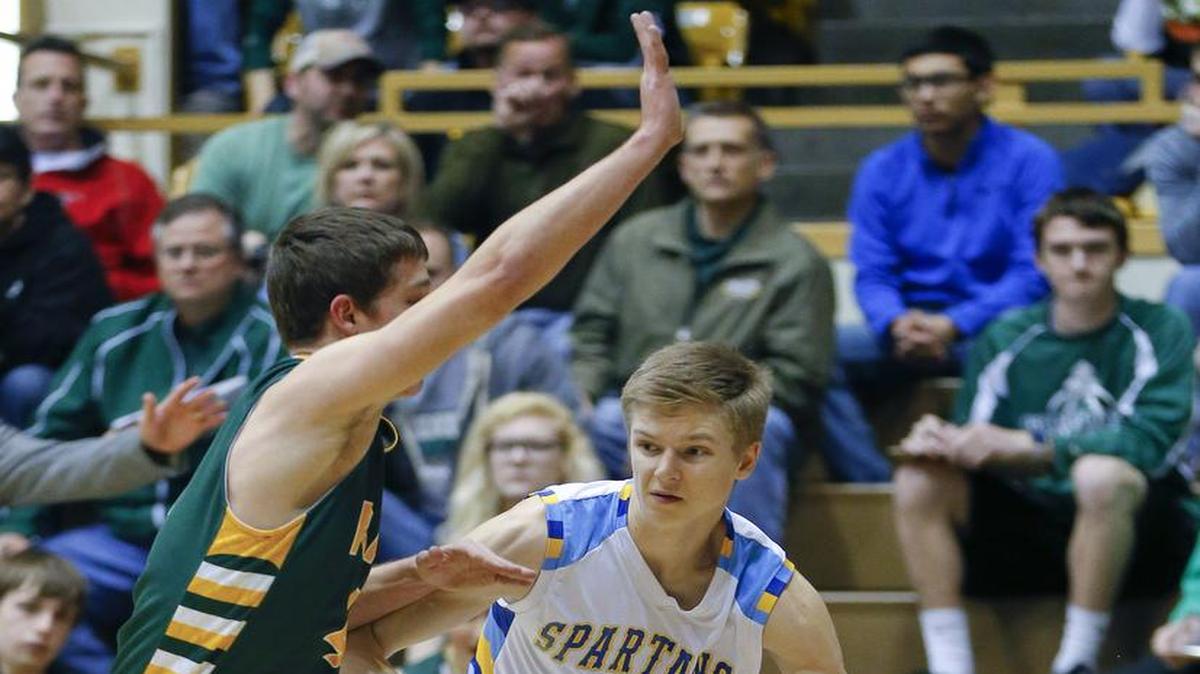 Collegiate's Riley Dick, right, drives down the baseline while being guarded by Pratt's Landen Studer during the first half of Friday's 4A Division II semifinal in Emporia.