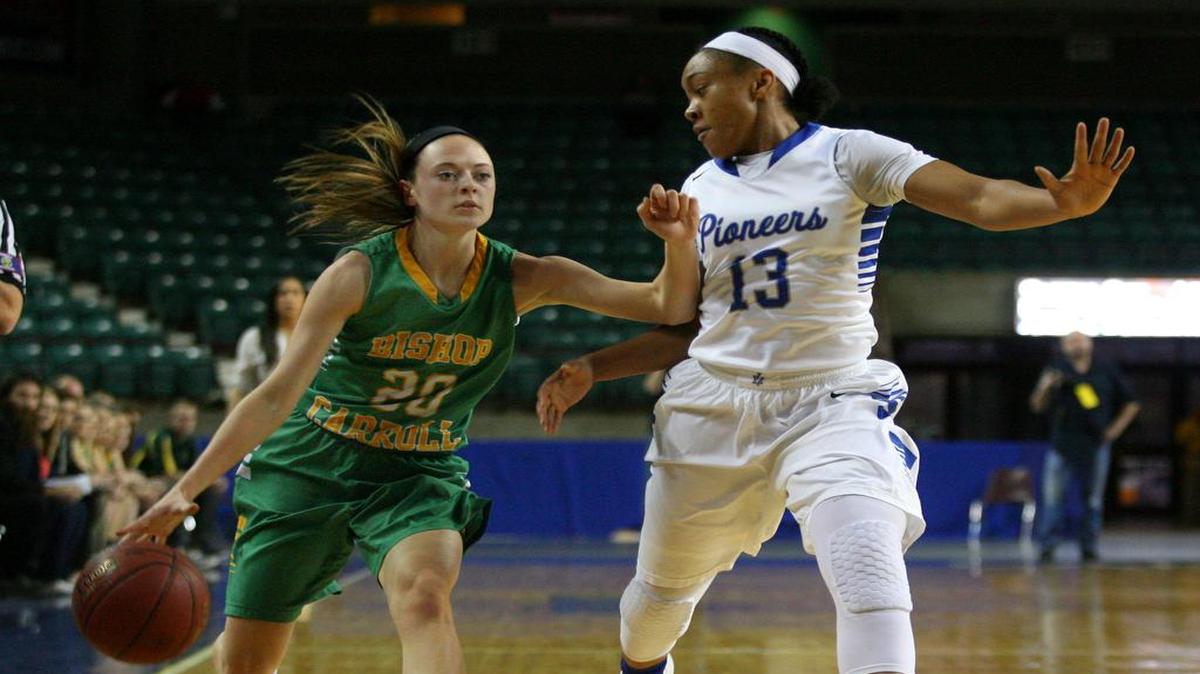 Carroll’s Brynn Maul (20) is guarded by Leavenworth’s Alicia Brown during the 5A state tournament at the Kansas Expocentre in Topeka.