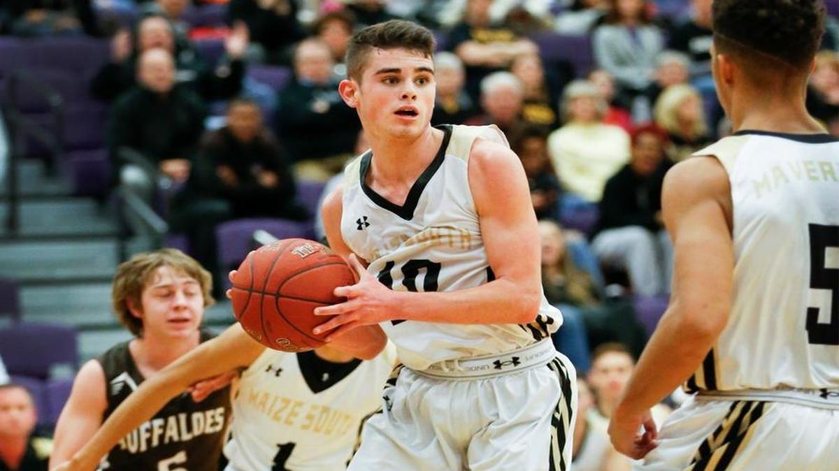 Maize South's Seth Jennings, center, starts the fast break against Garden City in the first quarter during the Valley Center Invitational Tournament Thursday. (Jan. 21, 2016)