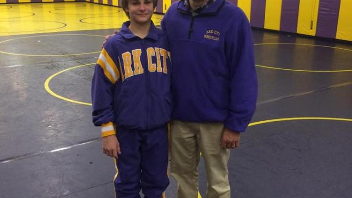 Arkansas City wrestling coach Greg Buckbee and his son, Gabe, a freshman wrestler.