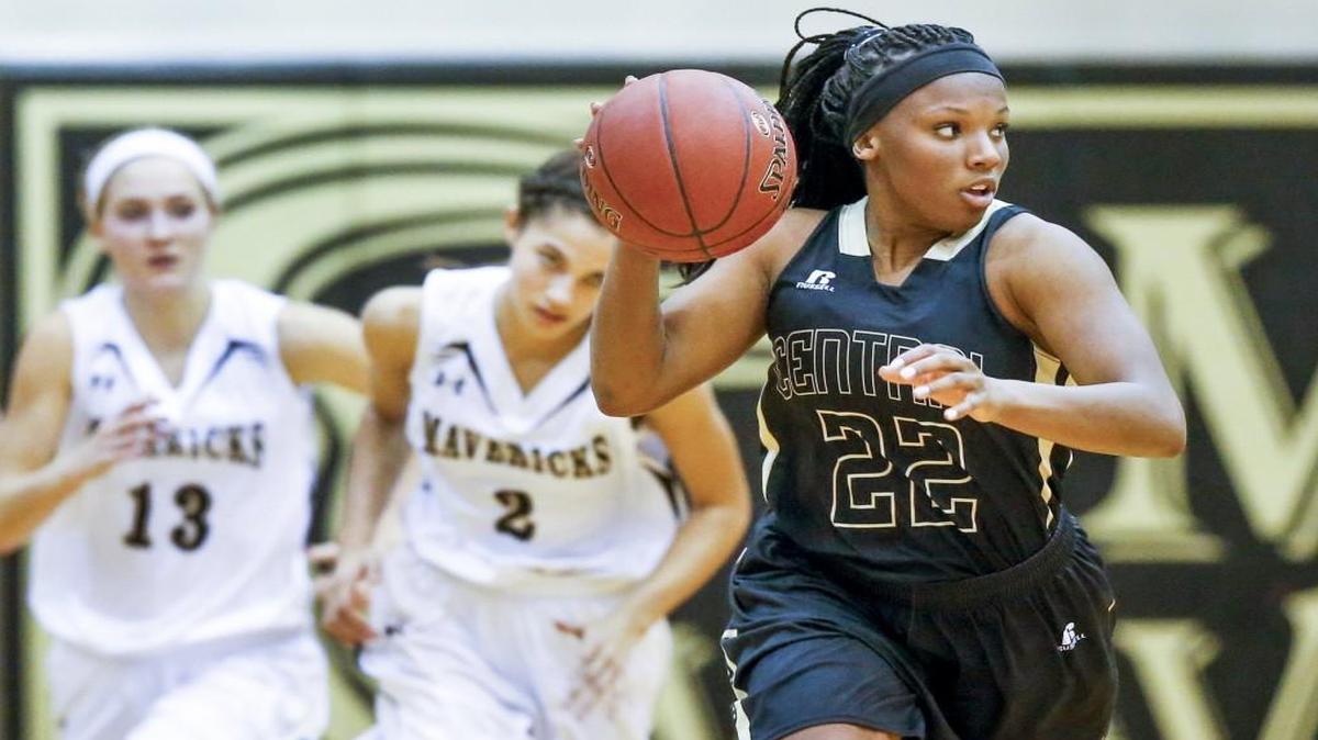 Andover Central's Jewell Bolden (22) brings the ball up against Maize South's Sierra Mortensen (13) and Lauren Johnson (2) in the second half during Andover Central's 57-44 win at Maize South on Tuesday.