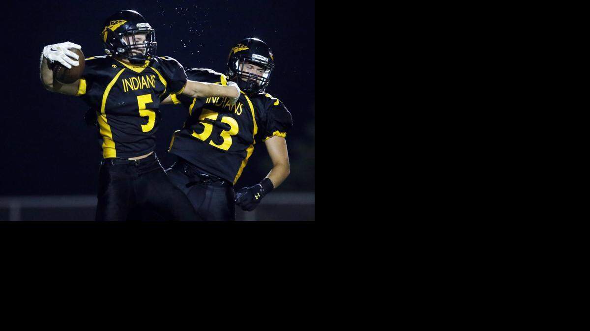 
Andale’s Hank Eck, left, celebreates with Kelton Deaver after his fourth-quarter touchdown that provided the winning margin over Collegiate.
