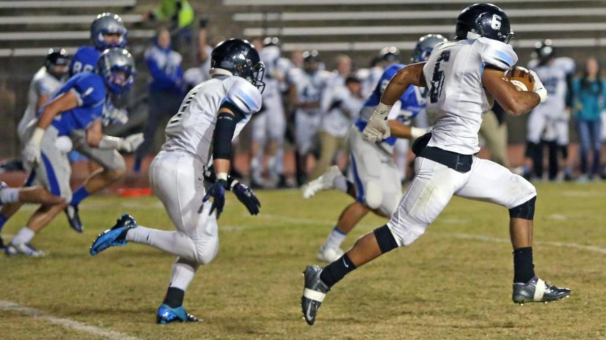 Eisenhower's Drake Damon returns a blocked field goal attempt for a touchdown on Nov. 6.