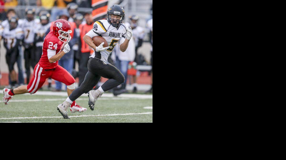
Andale's Hank Eck (5) breaks away from McPherson's Casey Cheek for a touchdown in the first quarter Friday at McPherson College.
