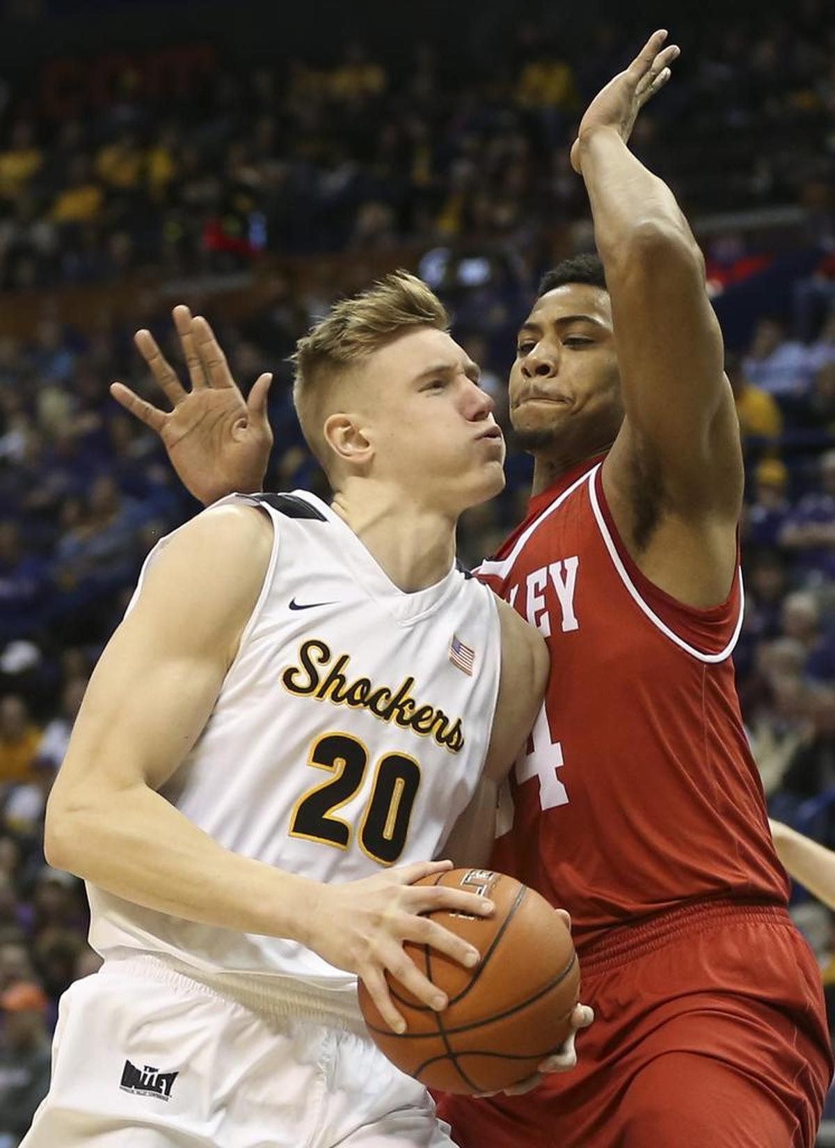Wichita State center Rauno Nurger goes to the basket against Bradley guard JoJo McGlaston during the second half of their quarterfinal game of the Missouri Valley Conference Tournament in St. Louis on Friday.