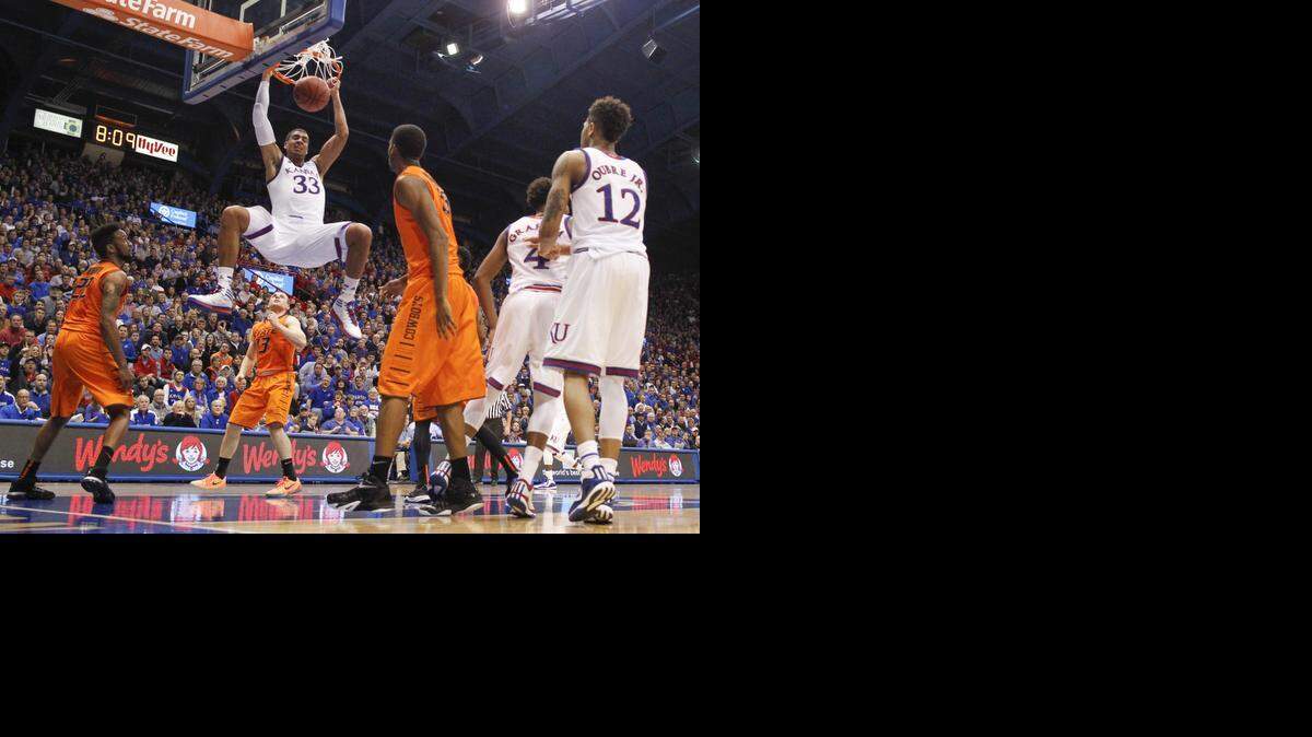 
Kansas forward Landen Lucas dunks the ball during the second half against Oklahoma State on Tuesday night at Allen Fieldhouse. The Jayhawks went on to win 67-57. 
