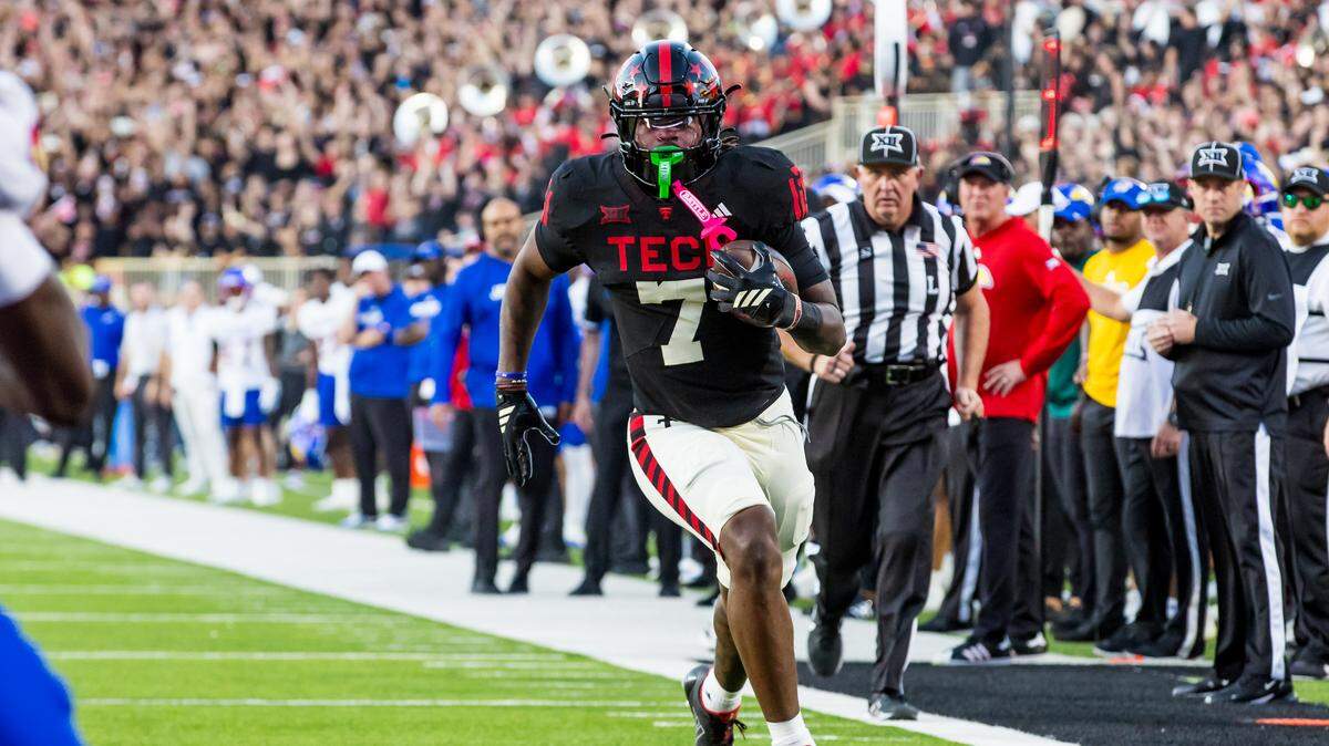 Terrance Carter Jr. #7 of the Texas Tech Red Raiders runs with the ball during the first half of the game against the Kansas Jayhawks at Jones AT&T Stadium on October 11, 2025 in Lubbock, Texas.