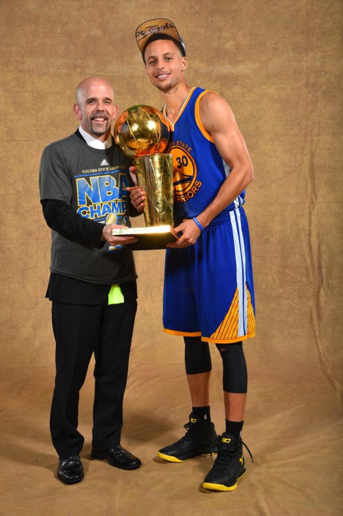 Golden State vice president of communications Raymond Ridder, a Wichita State super fan, poses with Warriors star Steph Curry and the Larry O’Brien trophy.