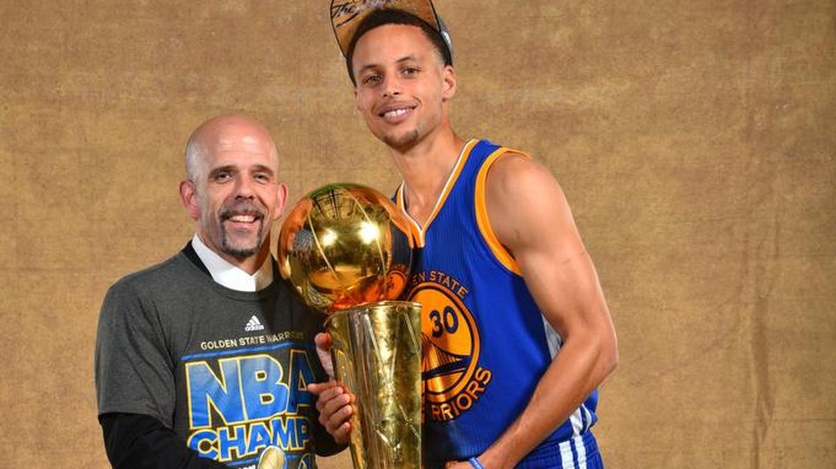 Golden State vice president of communications Raymond Ridder, a Wichita State super fan, poses with Warriors star Steph Curry and the Larry O’Brien trophy.