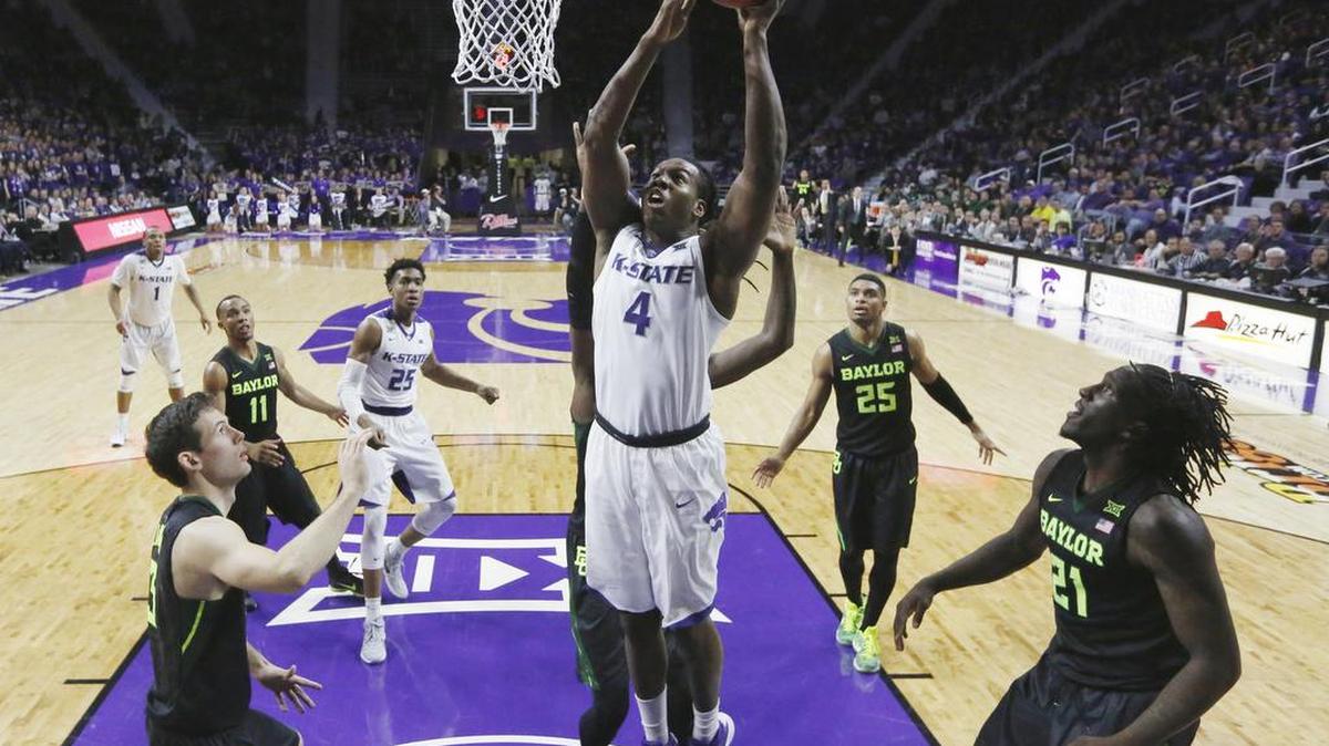 K-State forward D.J. Johnson (4) makes a shot against Baylor Wednesday night. Johnson lead scoring for K-State. (February 10, 2016)