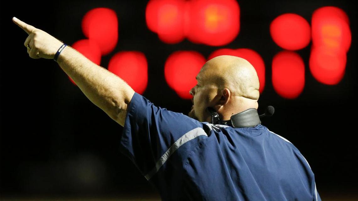 Northwest coach Steve Martin yells out instruction to his team during their game with Topeka in the second quarter. Northwest beat Topeka 29-28 in their first round playoff game at Northwest High Friday. (Oct. 28, 2016)