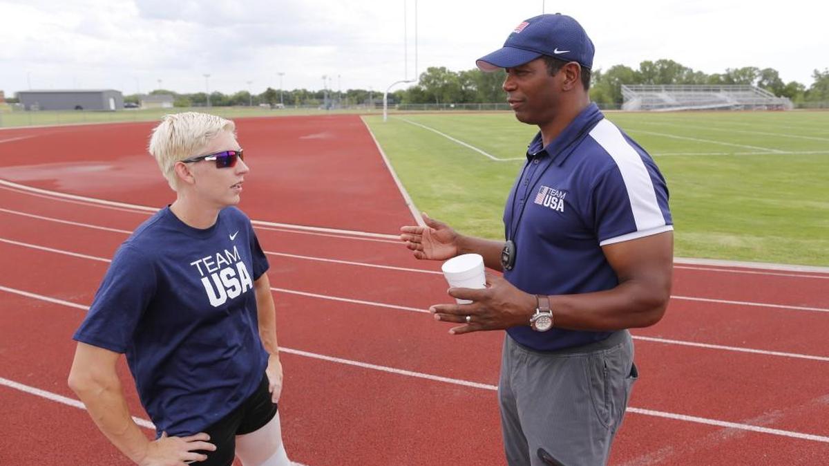 Liz Willis and her coach Roy Birch talk during a recent training session. Willis will compete in the 100-, 200- and 400-meter races at the Paralympics next month.