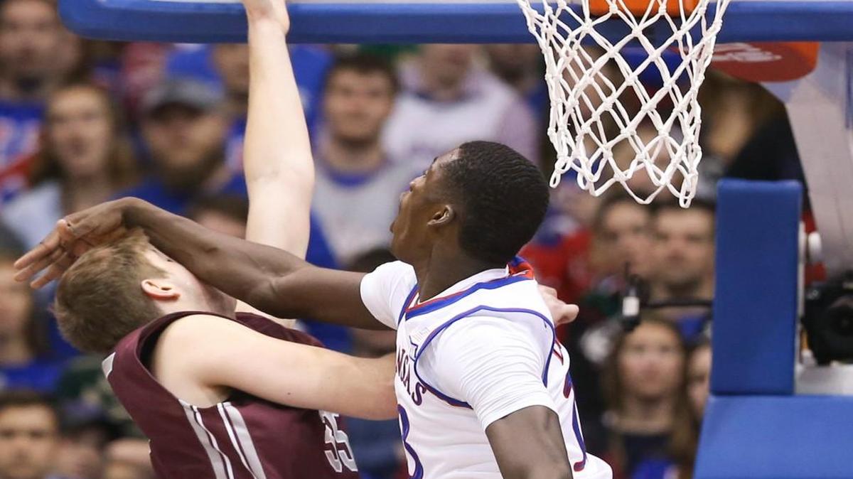 Kansas forward Cheick Diallo fouls Montana center Bryden Boehning during the first half of their game at Allen Fieldhouse in December.