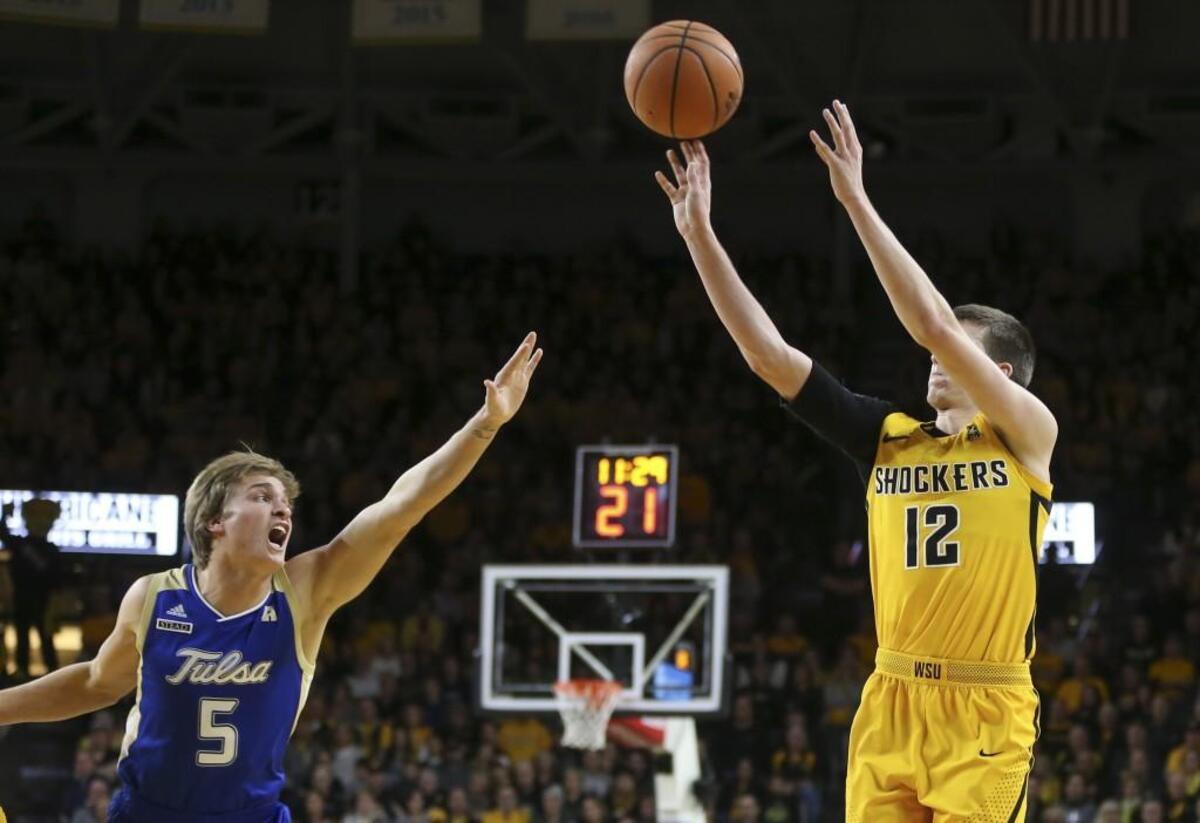 Wichita State guard Austin Reaves hits a three-pointer over Tulsa’s Lawson Korita suring January’s game at Koch Arena.