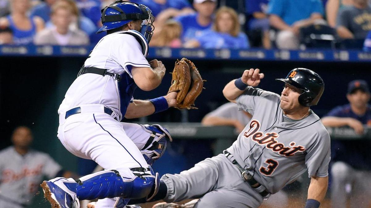 
The Tigers’ Ian Kinsler scored underneath the attempted tag of Royals catcher Drew Butera on a grounder by Tyler Collins in the eighth inning Wednesday night at Kauffman Stadium. 
