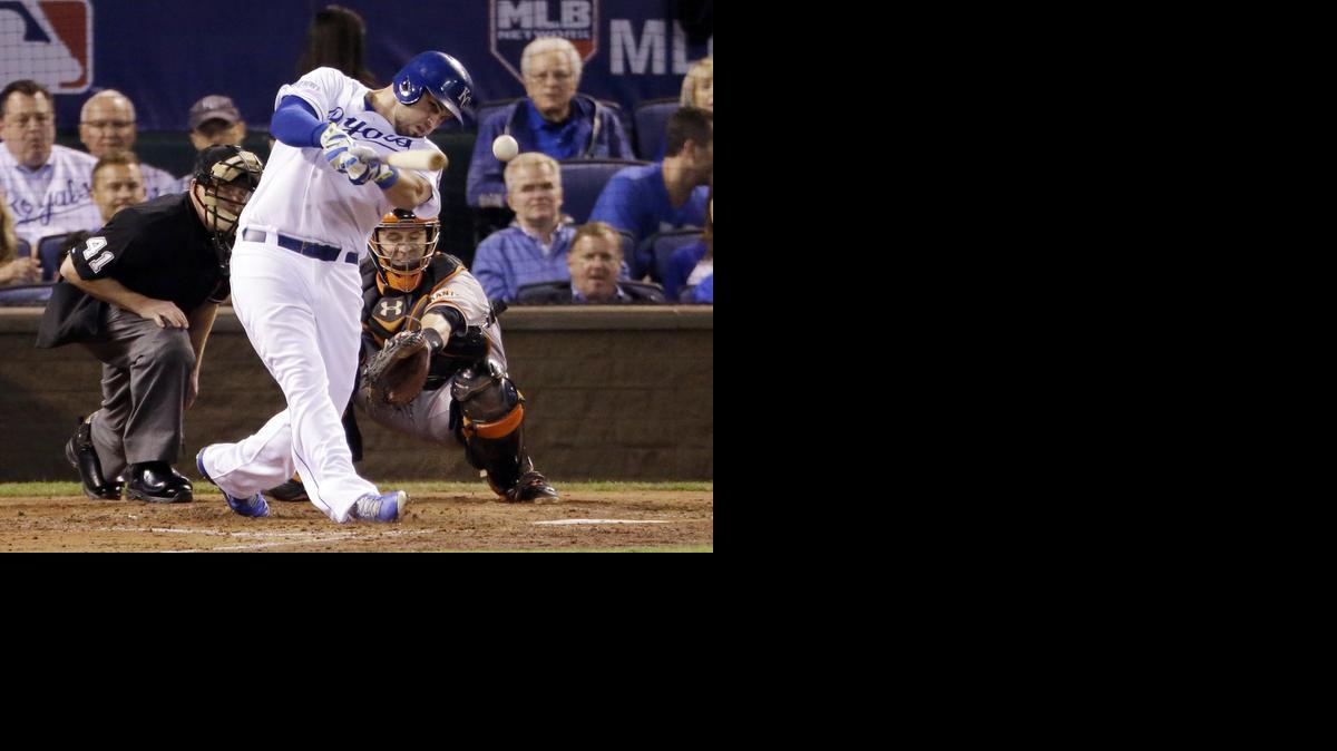 
Kansas City’s Mike Moustakas hits a double during the third inning of Game 1 of the World Series on Tuesday in Kansas City, Mo. The hit puts runners at second and third with no outs, but the Royals were unable to get a run home that inning.

