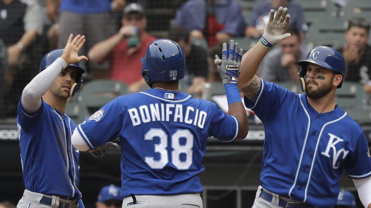 Kansas City Royals' Jorge Bonifacio, center, celebrates with Whit Merrifield, left, and Mike Moustakas after hitting a two-run home run during the first inning of a baseball game against the Chicago White Sox, Saturday, July 14, 2018, in Chicago.