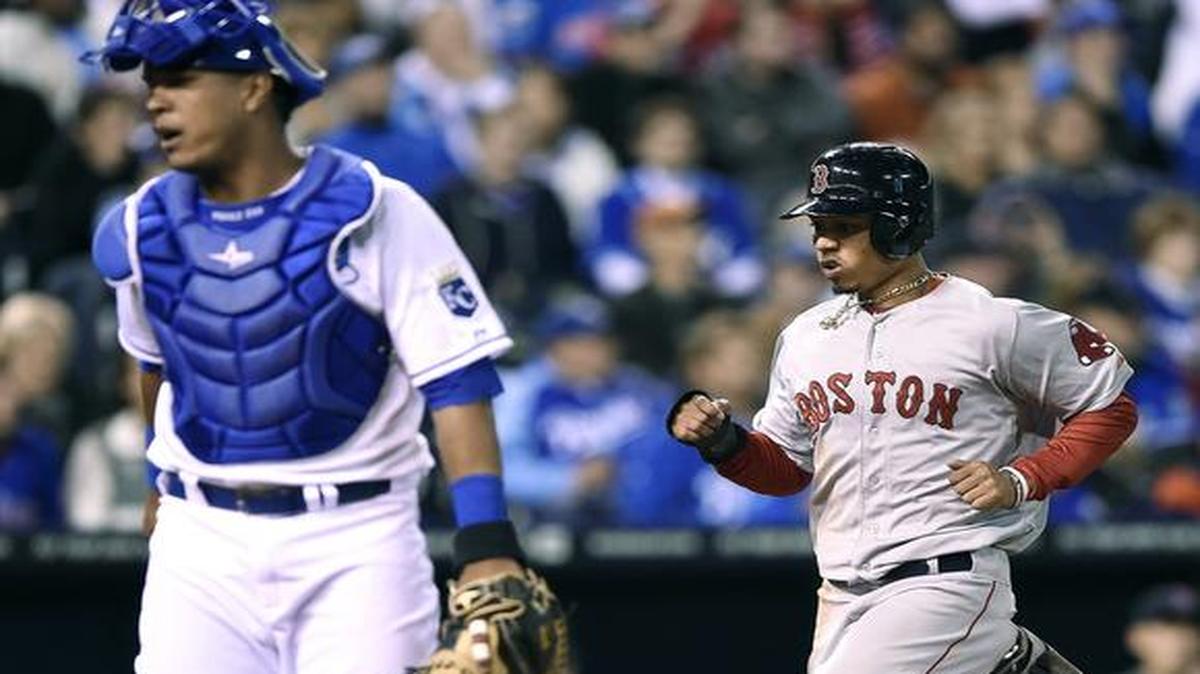 
Boston’s Mookie Betts scores behind Kansas City’s Salvador Perez on a single by David Ortiz in the fourth inning Thursday in Kansas City, Mo.
