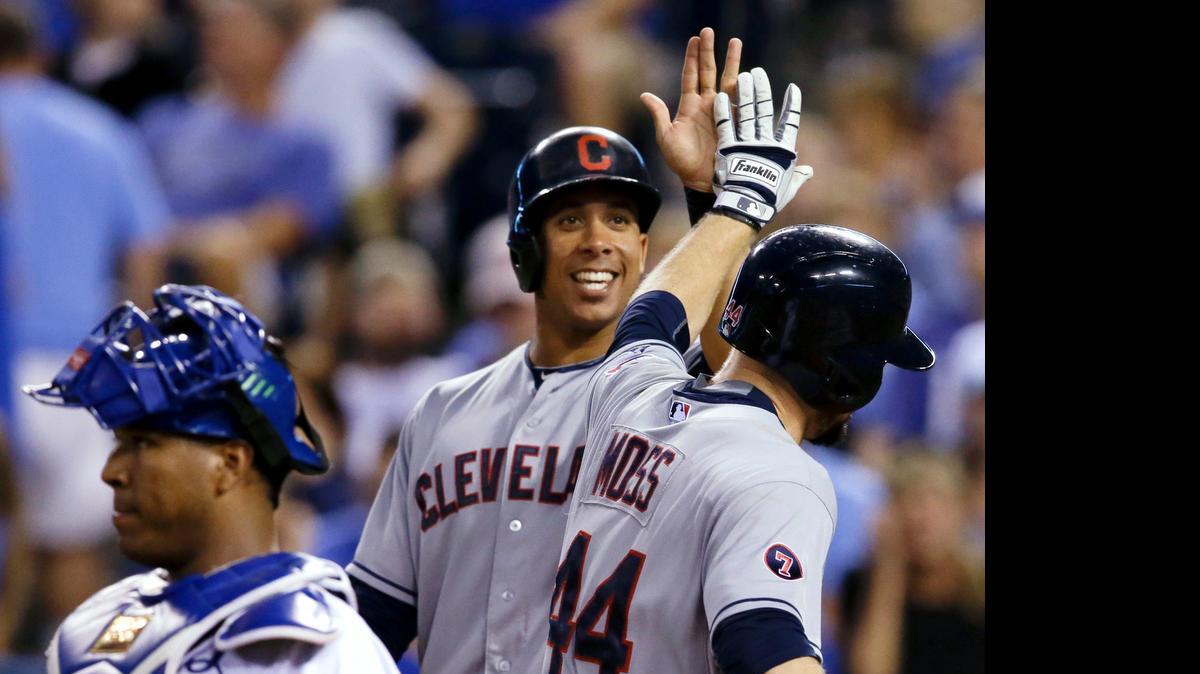 
Cleveland Indians' Michael Brantley, back, congratulates teammate Brandon Moss (44) on his two-run home run during the fifth inning of a baseball game against the Kansas City Royals on Thursday night.
