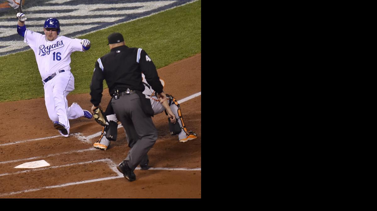 
Kansas City’s Billy Butler (16) scores on a double by Alex Gordon during the second inning against San Francisco in Game 7 of the World Series on Wednesday.
