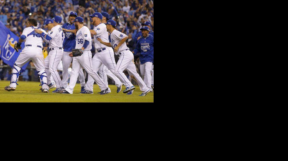 
Kansas City Royals players celebrate following Game 3 of baseball's AL Division Series in Kansas City, Mo., Sunday, Oct. 5, 2014. The Kansas City Royals defeated the Los Angeles Angels 8-3 to sweep the series. (AP Photo/Travis Heying) 
