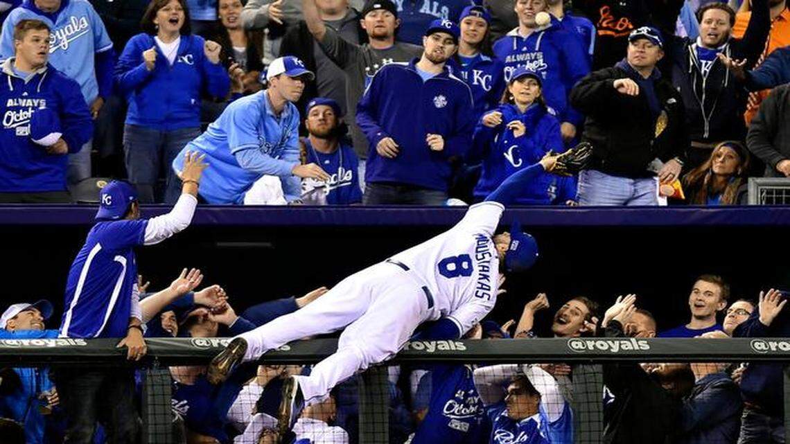 
Royals third baseman Mike Moustakas reaches for a foul ball hit by Baltimore Orioles center fielder Adam Jones in the sixth inning on Tuesday night at Kauffman Stadium. Moustakas made the catch and landed in the one of the stadium’s dugout suites.
