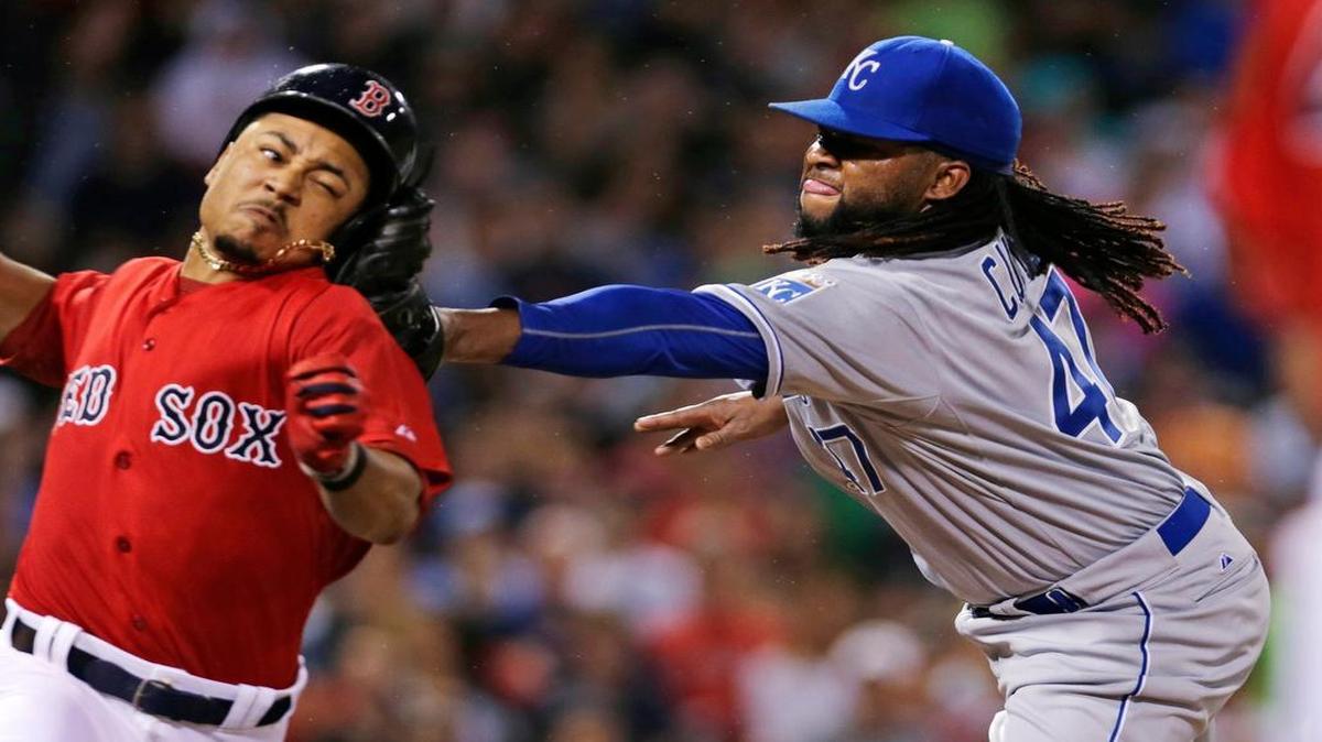 
Kansas City Royals starting pitcher Johnny Cueto applies the tag to the head of Boston’s Mookie Betts as he attempts to leg out a single on a grounder during the sixth inning Friday at Fenway Park in Boston. 
