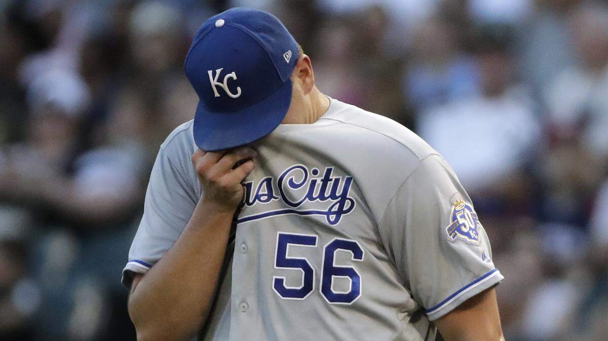Kansas City Royals starting pitcher Brad Keller wipes his face during the first inning of the team’s baseball game against the Chicago White Sox, Friday, July 13, 2018, in Chicago. (AP Photo/Nam Y. Huh)
