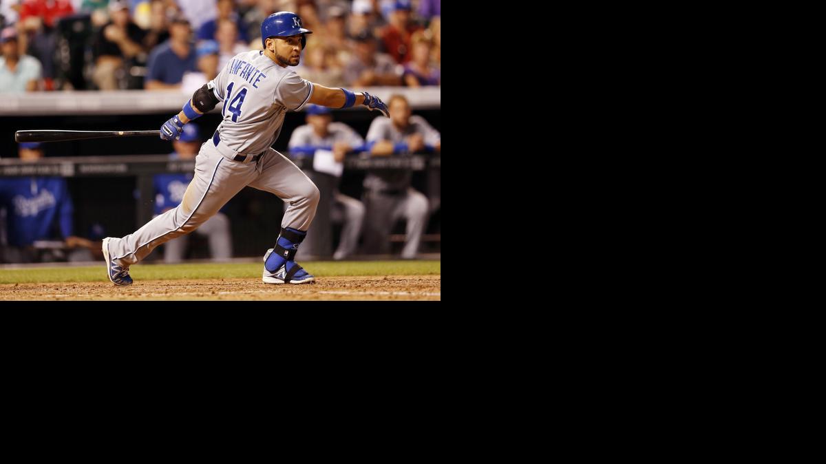 
Omar Infante hits a two-run double during the seventh inning of the Royals’ win over the Rockies on Tuesday night in Denver.
