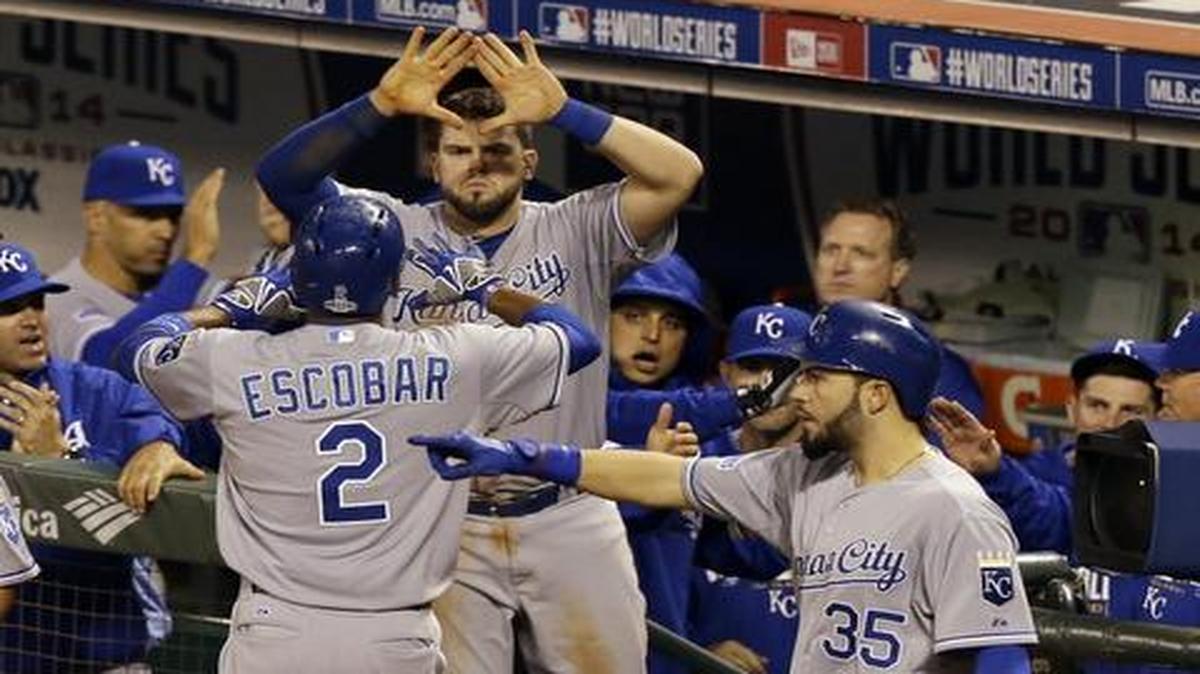 
Alcides Escobar (2) is congratulated by Royals teammates after scoring on an RBI double by Alex Gordon during the sixth inning Friday in San Francisco.
