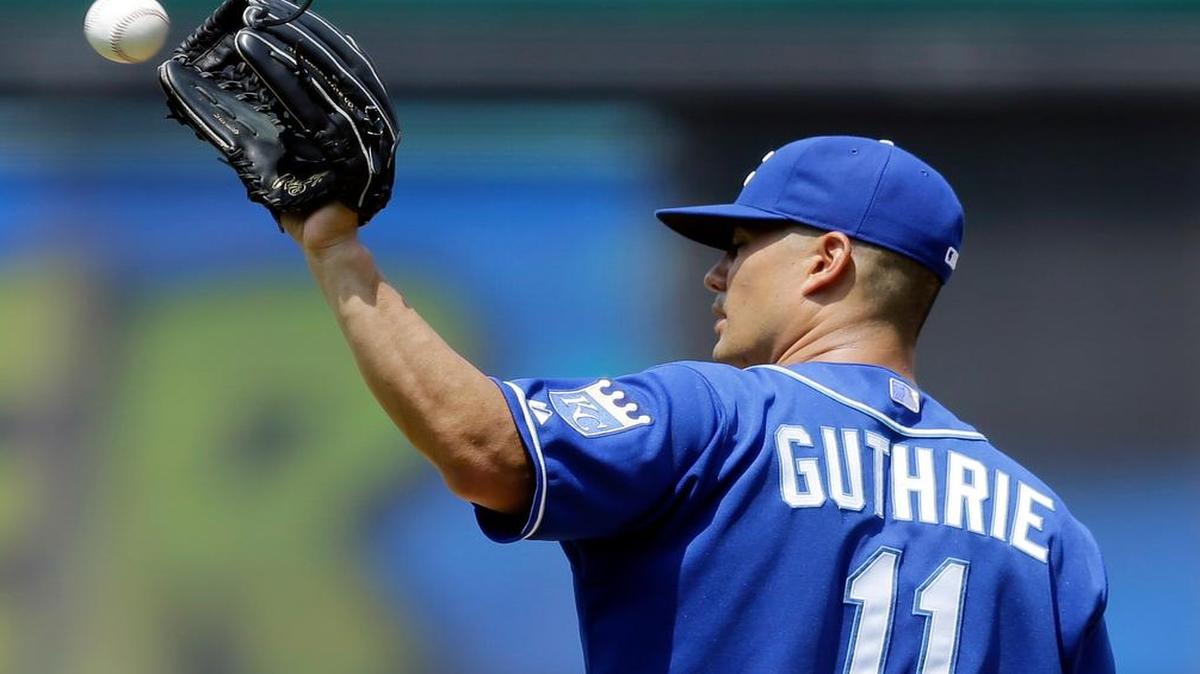 
Royals starting pitcher Jeremy Guthrie gets another ball as he waits for Cleveland’s Giovanny Urshela to run the bases after Urshela hit a solo home run in the sixth inning. 
