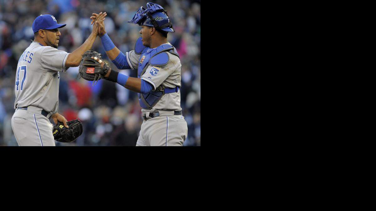 
Royals catcher Salvador Perez (right) congratulates relief pitcher Franklin Morales, left getting the final out against the Twins to end Monday’s baseball game in Minneapolis. The Royals won 12-3.
