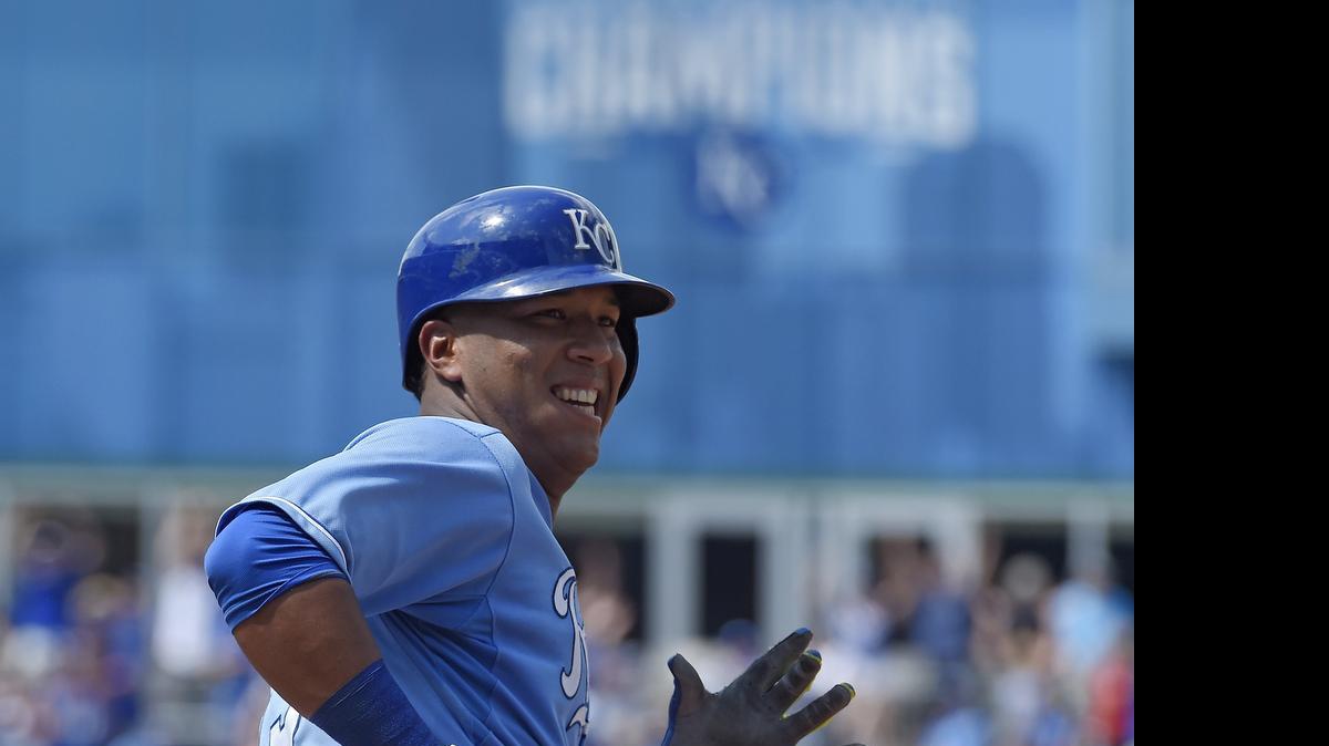 
Salvador Perez smiled as he rounded the bases after hitting a solo home run that broke a 3-3 tie with the Texas Rangers on Sunday at Kauffman Stadium. Closer Greg Holland protected the lead in the ninth, and the Royals won 4-3 to avoid a sweep in the three-game series.
