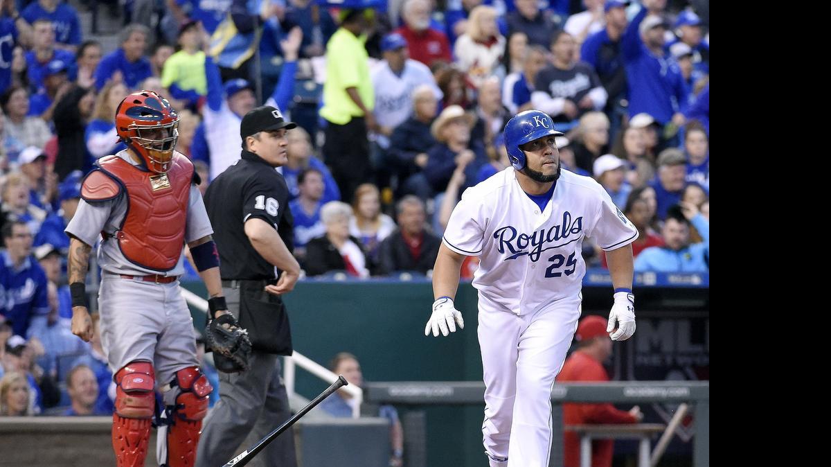 
The Kansas City Royals' Kendrys Morales (25) watches his second home run of the game head for the wall in front of St. Louis Cardinals catcher Yadier Molina in the third inning at Kauffman Stadium.
