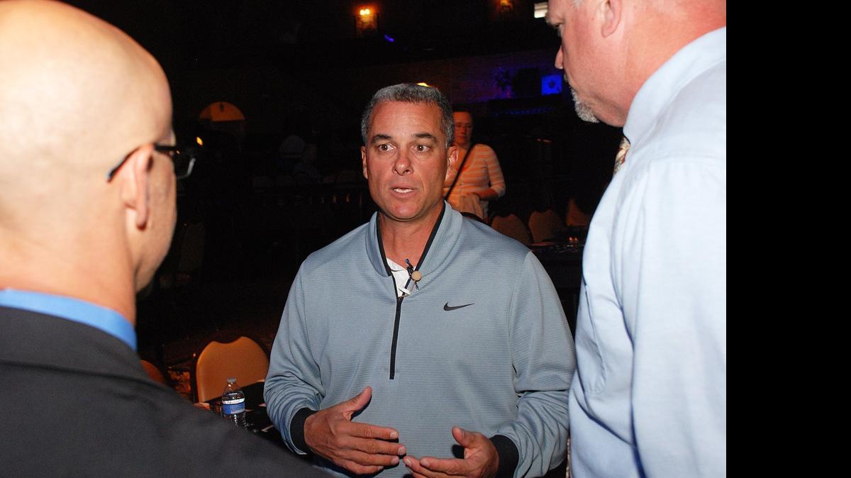 
Kansas City Royals general manager Dayton Moore talks with Rich Trease, left, and Keith Townsend before the Fellowship of Christian Athletes banquet Monday evening at Crown Uptown.
