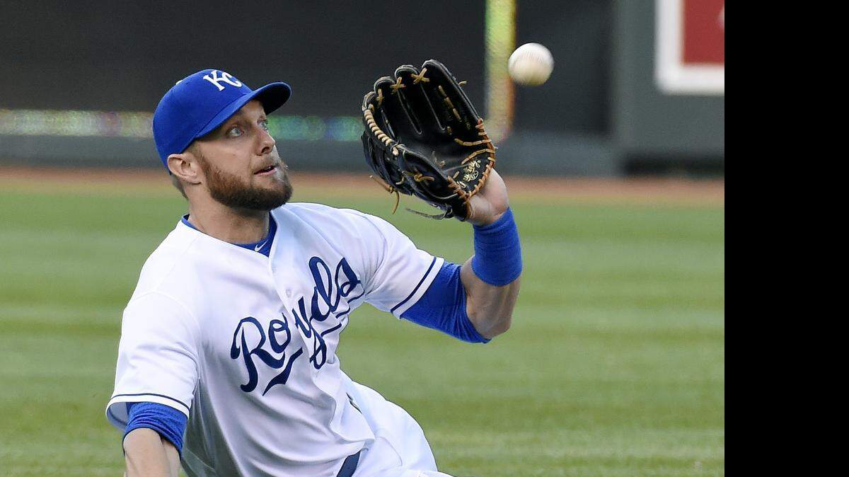 
Royals left fielder Alex Gordon makes a sliding catch for an out on the Twins' Danny Santana during Monday's baseball game at Kauffman Stadium.
