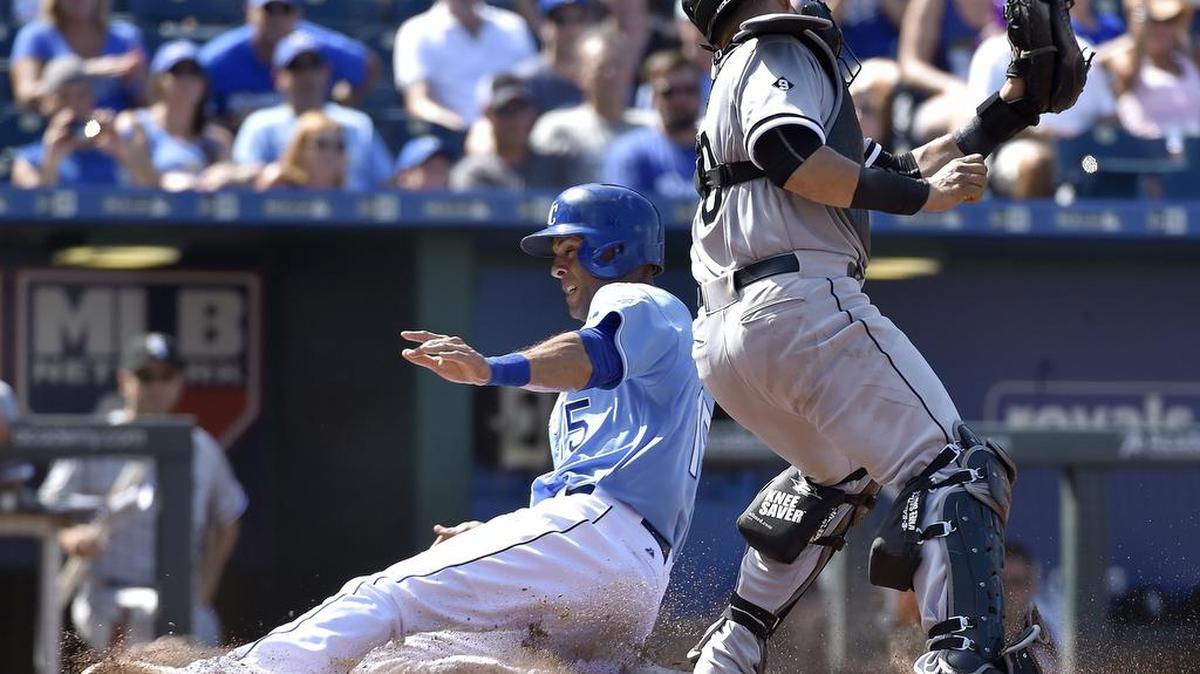
The Royals’ Alex Rios (15) scored ahead of the tag from Chicago catcher Tyler Flowers on a fielder’s choice RBI by Omar Infante in the eighth inning Sunday at Kauffman Stadium. The run proved to be the winning margin in the Royals’ 5-4 win over the White Sox.
