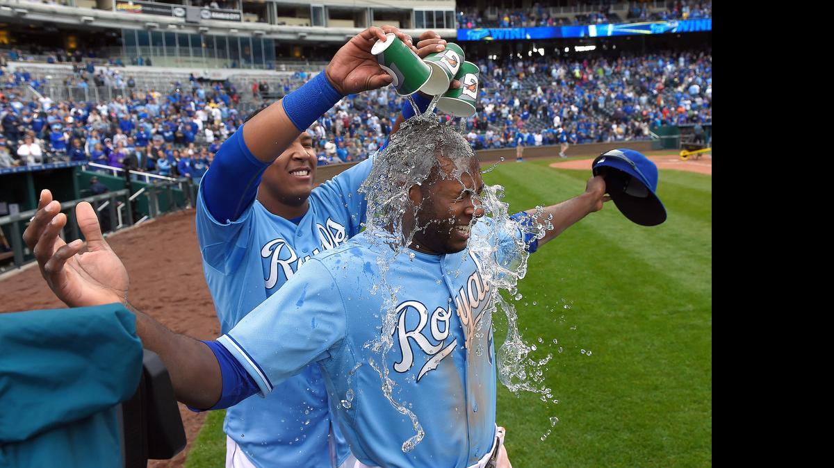 
Kansas City Royals' Lorenzo Cain (6) gets a small dunking by Salvador Perez (13) after the team's 4-2 win over the Oakland Athletics on Sunday at Kauffman Stadium in Kansas City, Mo.
