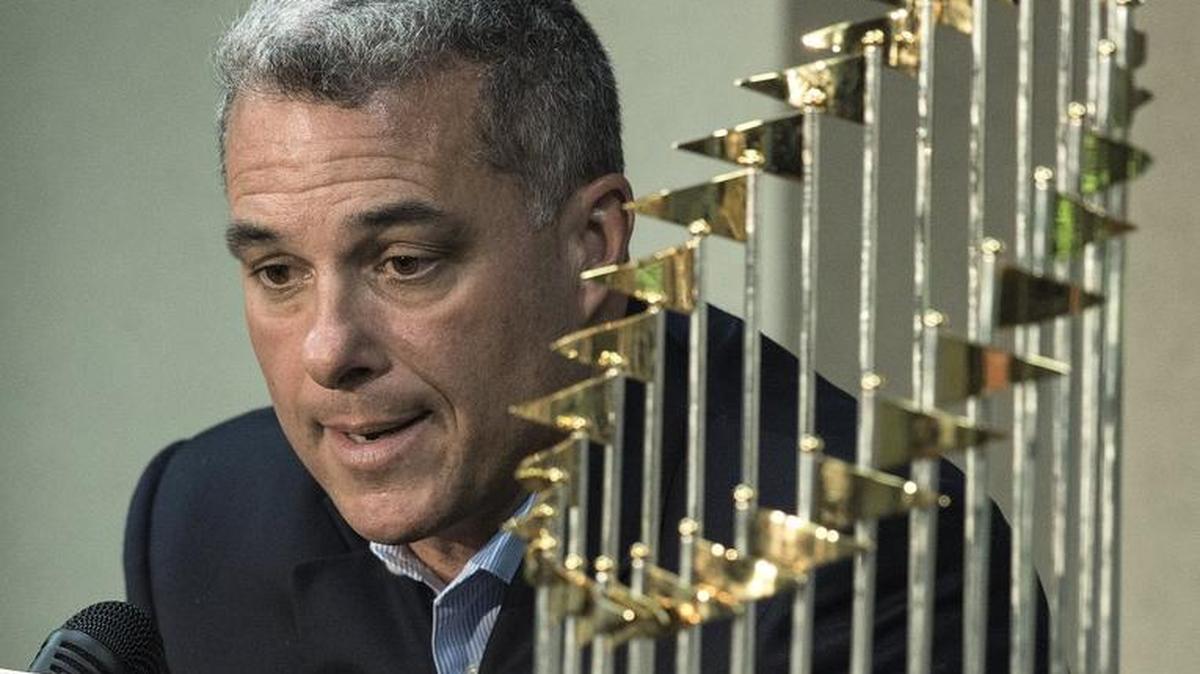 Royals general manager Dayton Moore is pictured with the World Series trophy on Nov. 5.