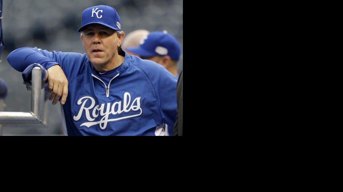 
Kansas City manager Ned Yost leans against a batting cage during a World Series workout. 
