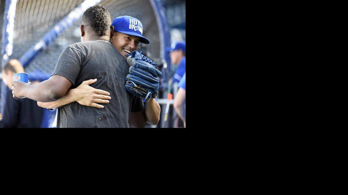 
Kansas City Royals pitcher Jeremy Guthrie hugged San Francisco Giants pitcher Juan Gutierrez before batting practice during World Series media day Monday, October, 20, 2014, at Kauffman Stadium in Kansas City, Mo.
