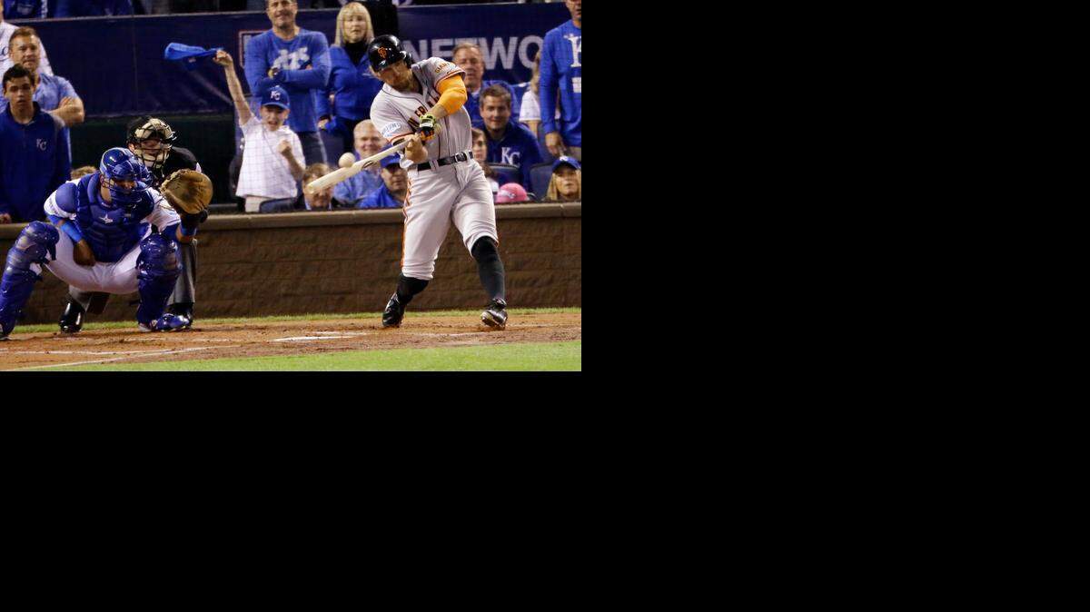 
San Francisco’s Hunter Pence hits a two-run home run during the first inning of Game 1 of the World Series on Tuesday night in Kansas City.
