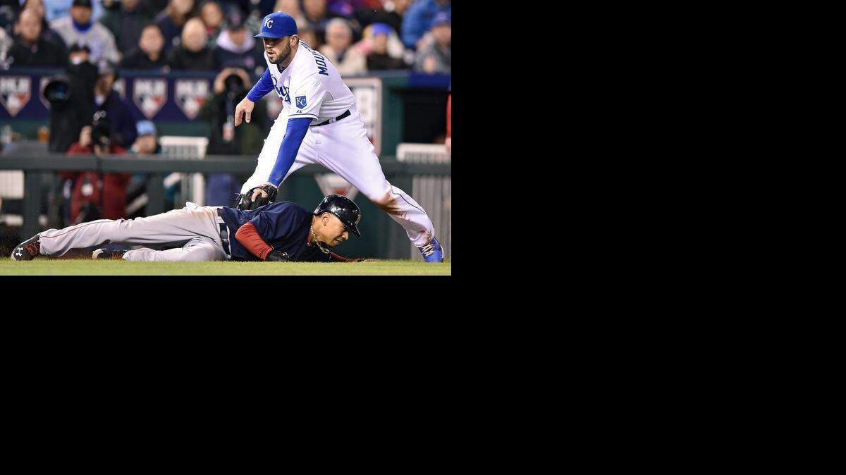 
Royals third baseman Mike Moustakas catches the Red Sox's Mookie Betts in a rundown between home and third to end the top of the fifth inning during Friday's game at Kauffman Stadium.
