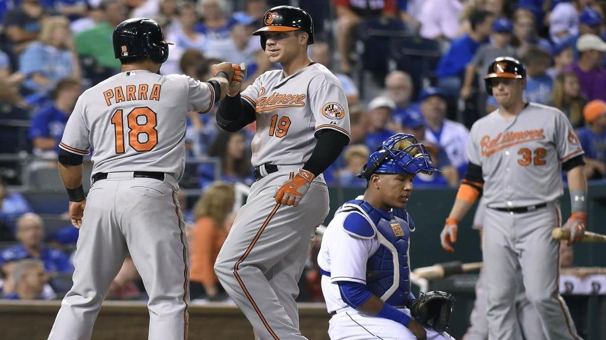 
The Orioles’ Gerardo Parra, left, congratulates Chris Davis in front of Royals catcher Salvador Perez after Davis hit a two-run home run in the fifth inning Wednesday at Kauffman Stadium in Kansas City, Mo. 
