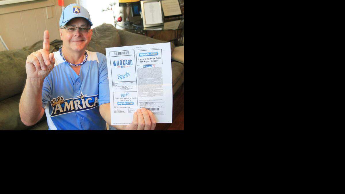
Kansas City Royals fan Greg Sanderson shows off his Wild Card playoff ticket for Tuesday's game against the Oakland Athletics. Sanderson will attend the game wearing his favorite Royals gear, a jersey and cap from the 2012 All-Star Game played at Kauffman Stadium in Kansas City.
