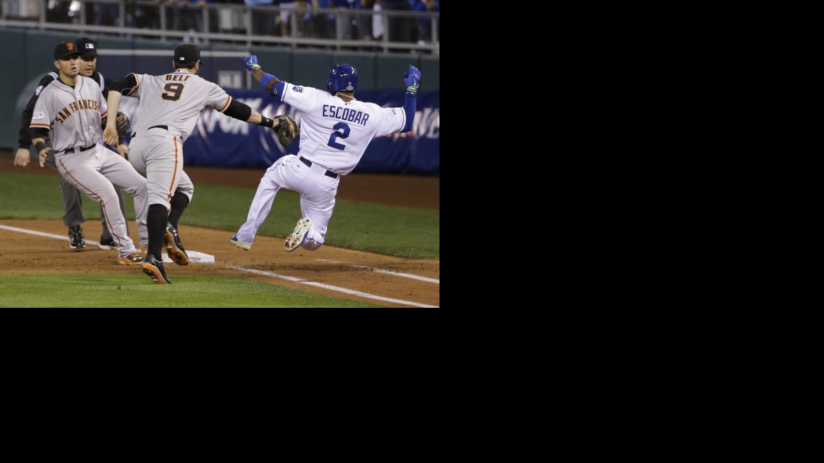 
The Royals Alcides’ Escobar beats San Francisco’s Brandon Belt to first base for an infield single that helped fuel Kansas City’s seven-run second inning Tuesday at Kauffman Stadium. 
