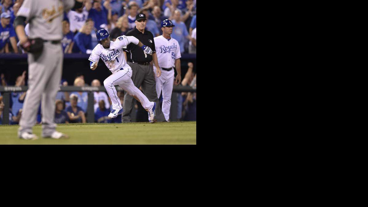 
Jarrod Dyson runs for home on a sacrifice fly by Royals teammate Norichika Aoki in the ninth inning during Tuesday's wild card game at Kauffman Stadium. 
